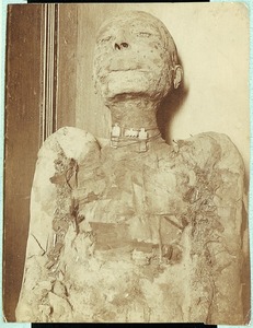 Mummy with amulets around its neck: Mummy of a priest of Amen. 21st Dynasty., Photo by Grafton Elliot Smith, courtesy of The Nicholson Museum, the University of Sydney, Copyright University of Sydney